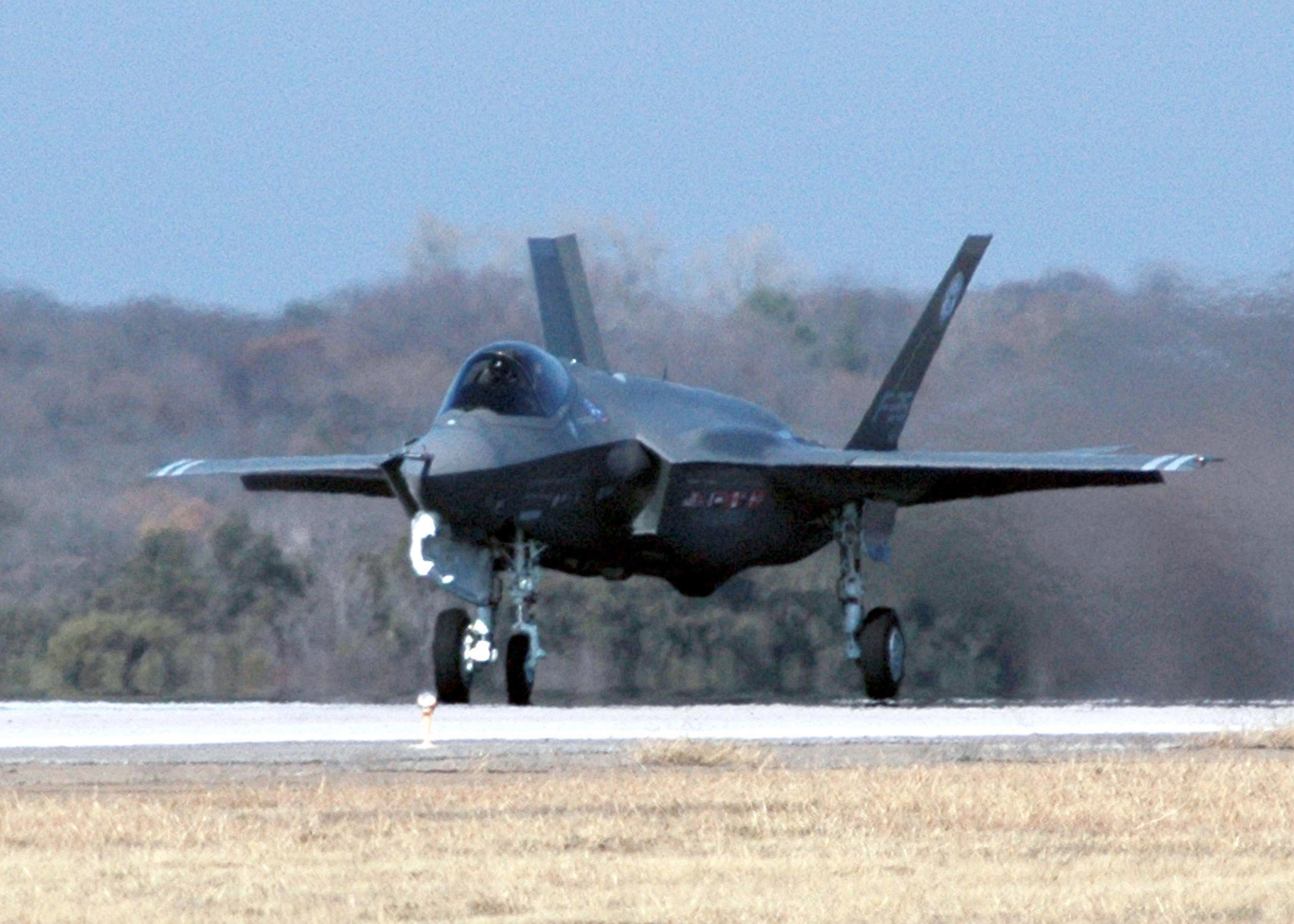 The F-35 Joint Strike Fighter (JSF) Lightning II, built by Lockheed Martin, takes off for its first flight on Joint Reserve Base Fort Worth, Texas, Dec. 15, 2006, during a test of the aircraft's initial capability. The U.S. Defense Department and eight o ther allied countries have contracted Lockheed Martin as part of the JSF program, which was designed to maximize efficiency and minimize the life cycle, costs of a future multi-role fighter jet. (U.S. Navy photo by Mass Communication Specialist 2nd Class  D. Keith Simmons) (Released)