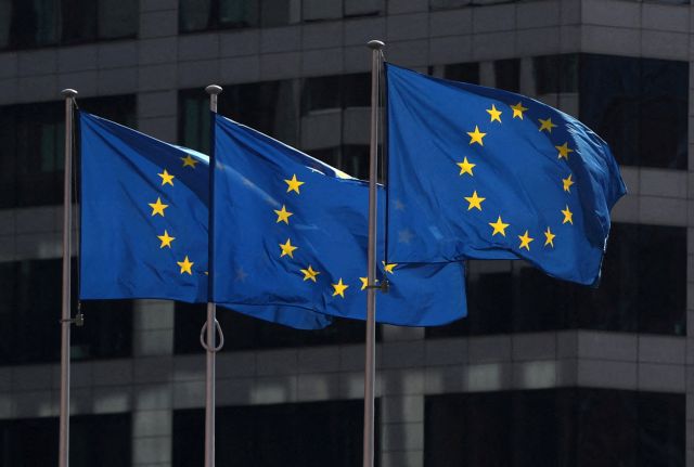 FILE PHOTO: European Union flags fly outside the European Commission headquarters in Brussels, Belgium, April 10, 2019. REUTERS/Yves Herman/File Photo