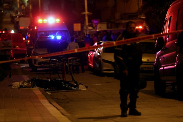 A dead body lies on the ground at the scene of an attack in which people were killed by a gunman on a street in Bnei Brak, near Tel Aviv, Israel, March 29, 2022. REUTERS/Nir Elias