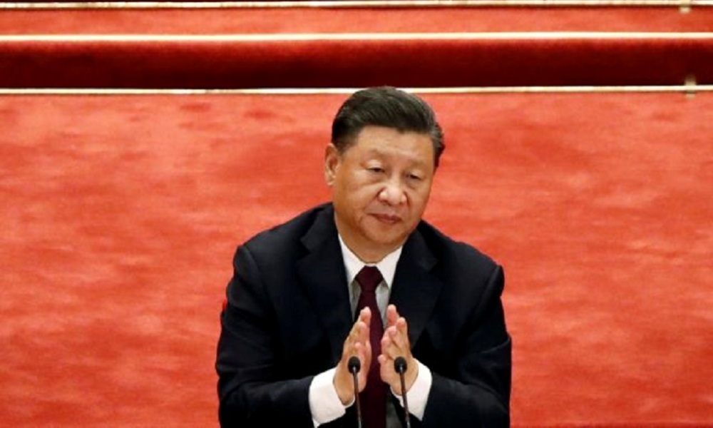 Chinese President Xi Jinping applauds during a meeting to commend role models in China's fight against the coronavirus disease (COVID-19) outbreak, at the Great Hall of the People in Beijing, China September 8, 2020. REUTERS/Carlos Garcia Rawlins