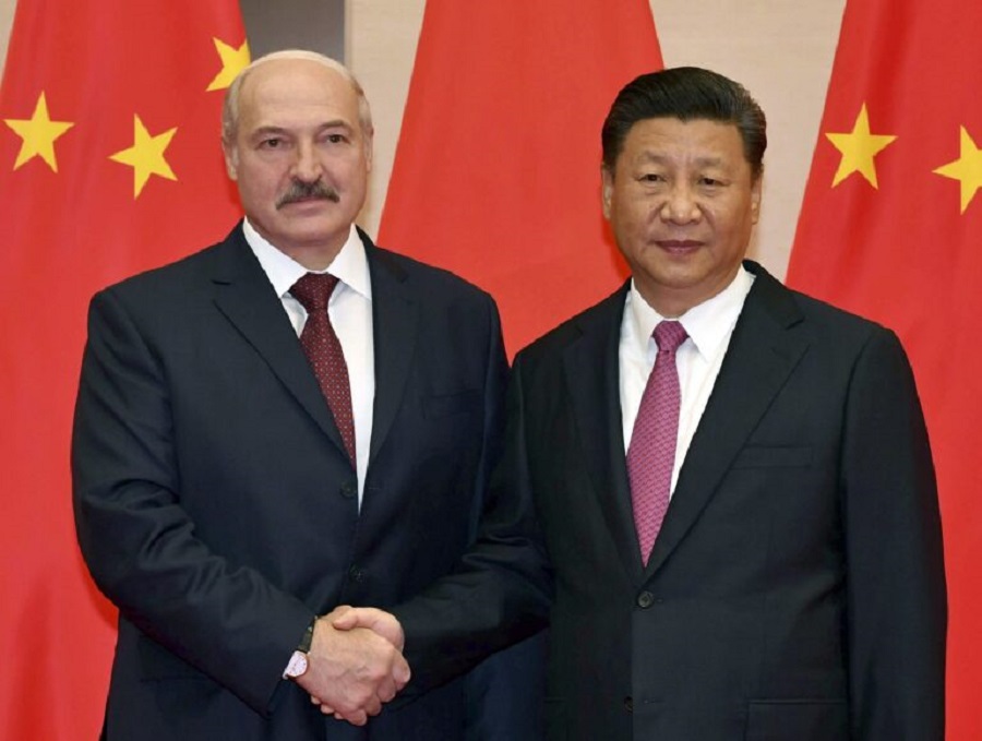 Belarusian President Alexander Lukashenko, left, and Chinese President Xi Jinping pose for a photo at the Shanghai Cooperation Organization (SCO) Summit in Qingdao in eastern China's Shandong Province, Sunday, June 10, 2018. (Andrei Stasevich/BelTA Pool Photo via AP)