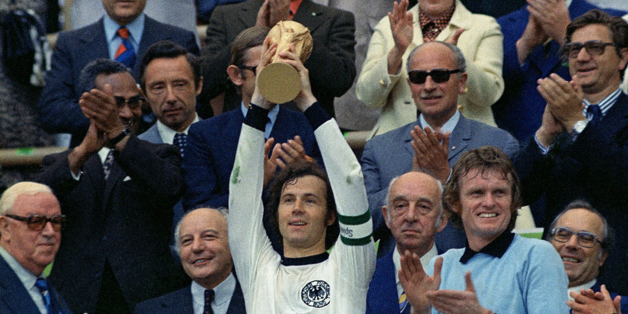 FILE - West Germany captain, Franz Beckenbauer holds up the World Cup trophy after his team defeated the Netherlands 2-1, in the World Cup final soccer match at Munich's Olympic stadium, in West Germany on July 7, 1974. (AP Photo/File)