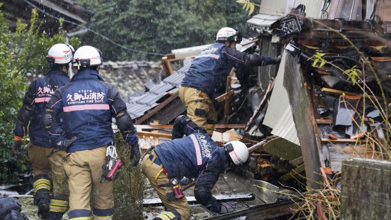 Firefighters conduct a search operation in Suzu, Ishikawa prefecture, Japan Sunday, Jan. 7, 2024. A major earthquake slammed western Japan on Jan. 1, killing scores of people, toppling buildings and setting off landslides. (Kyodo News via AP)