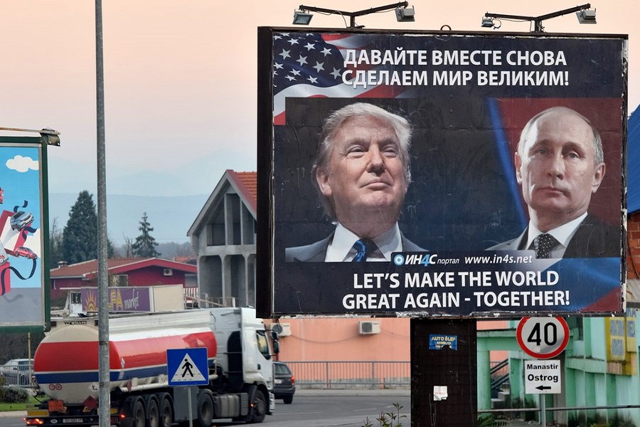 epa05634156 A billboard by pro-Serbian movement shows the image US President-elect Donald Trump and Russian President Vladimir Putin as a truck drives past in the town of Danilovgrad, Montenegro, 16 November 2016. Presidents Donald Trump and Vladimir Putin spoke by phone of better relations in the future between Washington and Moscow on 15 November.  EPA/BORIS PEJOVIC