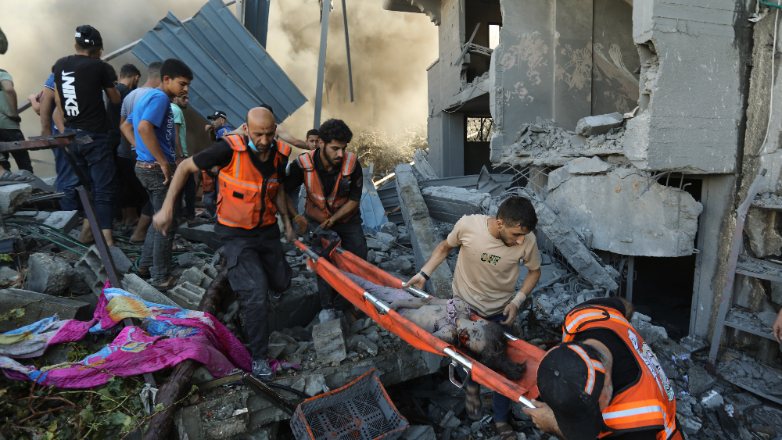 EDS NOTE: GRAPHIC CONTENT - Palestinians carry a dead child that was found under the rubble of a destroyed house following an Israeli airstrike in Gaza City, Saturday, Nov. 4, 2023. (AP Photo/Abed Khaled)