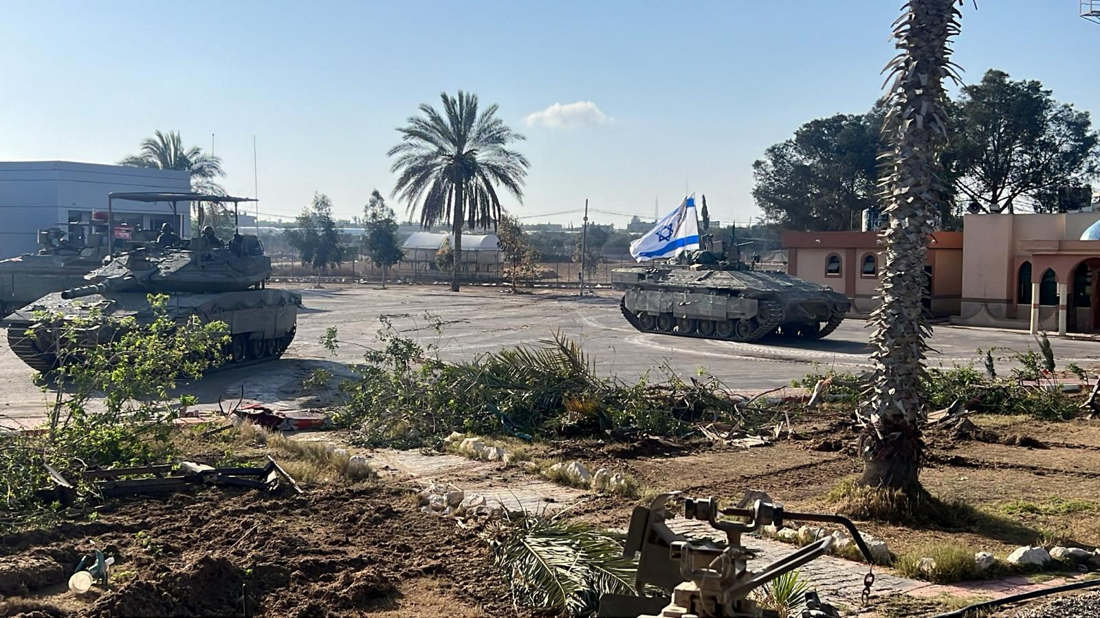 Israeli military vehicles operate in the Gazan side of the Rafah Crossing, amid the ongoing conflict between Israel and Palestinian Islamist group Hamas, in the southern Gaza Strip, in this handout image released on May 7, 2024. Israel Defense Forces/Handout via REUTERS THIS IMAGE HAS BEEN SUPPLIED BY A THIRD PARTY